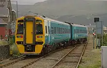 Arriva Trains Wales 158823 departs for Birmingham International.