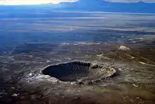 Image 9Meteor Crater in Arizona. Created 50,000 years ago by an impactor about 50 metres (160 ft) across, it shows that the accretion of the Solar System is not over. (from Formation and evolution of the Solar System)