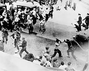 Image 16Striking teamsters armed with pipes battle police in the streets during the Minneapolis Teamsters Strike of 1934.