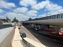 A long concrete viaduct with corrugated sheeting