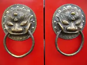 Image 23A traditional red Chinese door with Imperial guardian lion knocker (from Chinese culture)