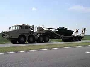 MZKT-74135 transporting a T-72