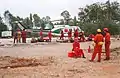 Helitack 140, a Bell 205A-1 and Ontario Ministry of Natural Resources firefighters working on Fire 141 in 1995