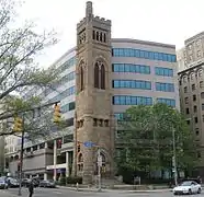 The 1889 bell tower from the former Bellefield Presbyterian Church is all that remains in front of the University of Pittsburgh's Bellefield Towers  building at the corner of Fifth and Bellefield Avenues.