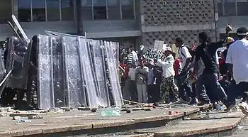 Image 39Riot police and protesters during the unrest in 2005. (from History of Belize)