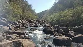 The rocky rapids of Nepean River flowing into the Basin (south side)