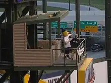 Bernie Brewer (left) in his dugout at American Family Field.