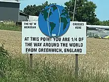 Sign in Meadowbrook marking 90ºW