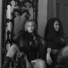 Cover art for "Sorry": A grayscale photo of Beyoncé, who sits on an ornately designed chair, and another woman beside her