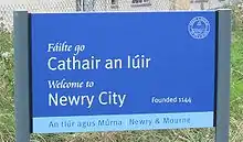 Bilingual welcome sign at Newry in Northern Ireland in Irish and English