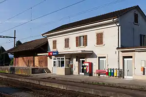 White two-story building with gabled roof