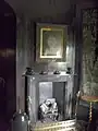 A view into the Oratory from the parlour, showing the fireplace and the portrait of "Dame Joan" Pendrell.