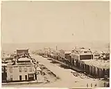 Slightly elevated view looking down city street with buildings lining street