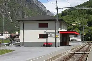 Square two-story building with hipped roof