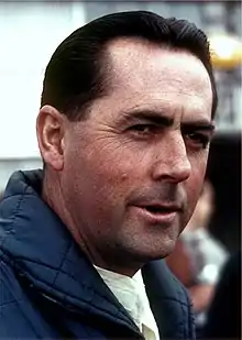 Jack Brabham looking to the left of the camera