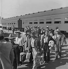 Image 67The first Braceros arrive in Los Angeles by train in 1942. Photograph by Dorothea Lange. (from History of Mexico)