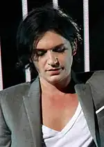 Brian_Molko_in_the_European_Parliament_(cropped).jpg