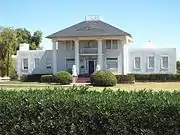 The "Old Spain House" (now known as the Nardini Manor) was built in 1886 and remodeled in 1912. It is located on 5601 S 195th Ave.