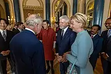 Eva Pavlová accompanying her husband during a HM King Charles III reception at Buckingham Palace, May 2023