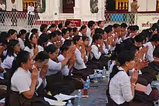 Image 19A group of Buddhist worshipers at Shwedagon Pagoda, an important religious site for Burmese Buddhists. (from Culture of Myanmar)