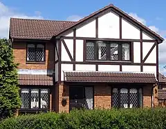 Image 46A 21st-century detached Mock Tudor house in Scotland. Its timber framing is typical of English Tudor architecture. (from Culture of the United Kingdom)