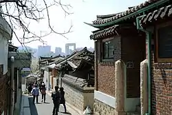 Bukchon Hanok village and modern building in the background