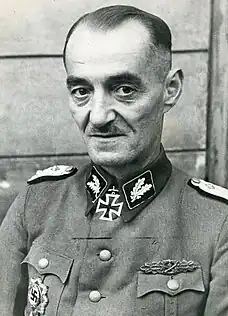 a black and white photograph of Oskar Dirlewanger in Waffen-SS uniform