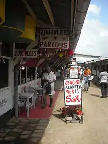 Image 50Butcher in the Central Market in Paramaribo with signs written in Dutch (from Suriname)