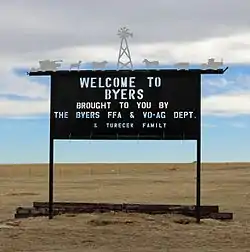 A welcome sign in Byers.