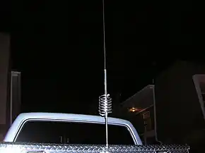 CB antenna with loading coil, mounted on pickup-truck metal tool box