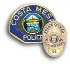 Badge and uniform patch of the Costa Mesa Police Department