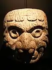 A Chavin stone sculpture in the shape of a head of a man, an ornament from a wall; 9th century BCE; Museo de la Nación (Lima, Peru)