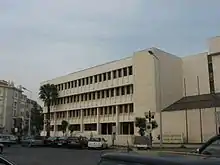 City hall. Four stories. Modern, brutalist, rectilinear design.