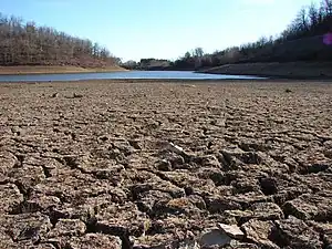 A dry lakebed in California, which is experiencing its worst megadrought in 1,200 years..mw-parser-output cite.citation{font-style:inherit;word-wrap:break-word}.mw-parser-output .citation q{quotes:"\"""\"""'""'"}.mw-parser-output .citation:target{background-color:rgba(0,127,255,0.133)}.mw-parser-output .id-lock-free a,.mw-parser-output .citation .cs1-lock-free a{background:url("//upload.wikimedia.org/wikipedia/commons/6/65/Lock-green.svg")right 0.1em center/9px no-repeat}.mw-parser-output .id-lock-limited a,.mw-parser-output .id-lock-registration a,.mw-parser-output .citation .cs1-lock-limited a,.mw-parser-output .citation .cs1-lock-registration a{background:url("//upload.wikimedia.org/wikipedia/commons/d/d6/Lock-gray-alt-2.svg")right 0.1em center/9px no-repeat}.mw-parser-output .id-lock-subscription a,.mw-parser-output .citation .cs1-lock-subscription a{background:url("//upload.wikimedia.org/wikipedia/commons/a/aa/Lock-red-alt-2.svg")right 0.1em center/9px no-repeat}.mw-parser-output .cs1-ws-icon a{background:url("//upload.wikimedia.org/wikipedia/commons/4/4c/Wikisource-logo.svg")right 0.1em center/12px no-repeat}.mw-parser-output .cs1-code{color:inherit;background:inherit;border:none;padding:inherit}.mw-parser-output .cs1-hidden-error{display:none;color:#d33}.mw-parser-output .cs1-visible-error{color:#d33}.mw-parser-output .cs1-maint{display:none;color:#3a3;margin-left:0.3em}.mw-parser-output .cs1-format{font-size:95%}.mw-parser-output .cs1-kern-left{padding-left:0.2em}.mw-parser-output .cs1-kern-right{padding-right:0.2em}.mw-parser-output .citation .mw-selflink{font-weight:inherit}Ivanova, Irina (2 June 2022). "California is rationing water amid its worst drought in 1,200 years". CBS News.