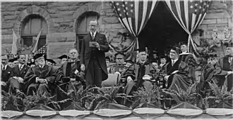 Calvin Coolidge addressing Georgetown graduates in front of Healy Hall