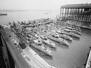 Image 30A fleet of naval forces being constructed in the Camden shipyards (1919) (from History of New Jersey)