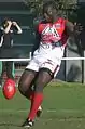 Northwind's All-International ruckman Manny Matata kicking a drop punt