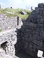 Saint Caomhan's church with Caomhan's grave (Leaba Chaomháin) in the background.