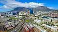 An aerial view of the city bowl from the harbour with Table Mountain in the background.