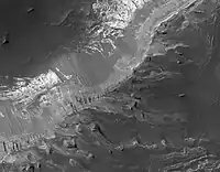 Capri Mensa, as seen by HIRISE.  Click on image to see buttes and layers.  Capri Mensa is found in the Coprates quadrangle of Mars.