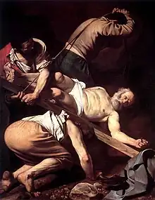 This painting is starkly realistic and is lit by dramatic lighting. It is viewed from a low angle which reveals the Peter's face as three men work to erect the cross on which he is nailed head downwards. One man drags on a rope, one lifts and the other is beneath the cross with his shoulder under it.