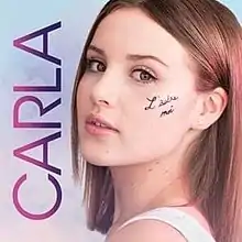 A young girl with "L'autre moi" written on her face next to the name "Carla" in all caps.