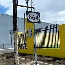 Sign for PR-864 in Hato Tejas barrio, looking east