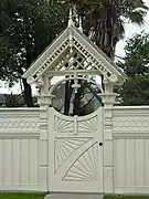 Victorian fencing and gate in the side yard of the Milton Carson Home.