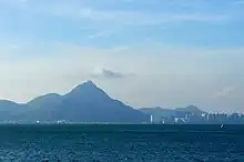 A view of Castle Peak from Tung Chung, showing the triangular shape of the hill (taken in 9 June 2011)(image by Malcolm Koo)