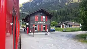 Two-story wooden building with gabled roof