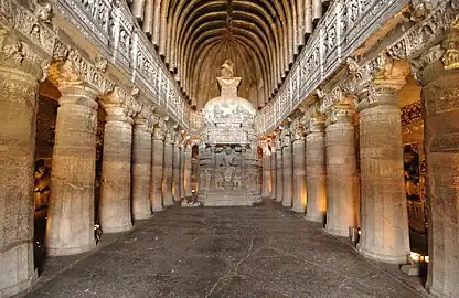 Buddhist "Chaitya Griha" or prayer hall, with a seated Buddha, Cave 26 of the Ajanta Caves.