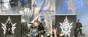 Celtic Frost live at Tuska Open Air Metal Festival 2006. The band's distinctive skull-and-spears logo can be seen on the banners.