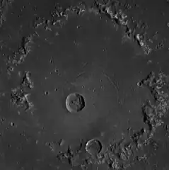 Central peak ring.  Concentric troughs are visible.