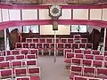 Chairs that replaced the pews in 1999 and Parliament clock (installed in 1818)